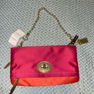 Coach Pink, orange and gold fold over handbag/clutch
